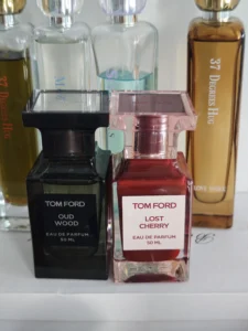 Side-by-side comparison of a luxury dark cherry perfume and IMIXX No.18 cherry almond vanilla perfume